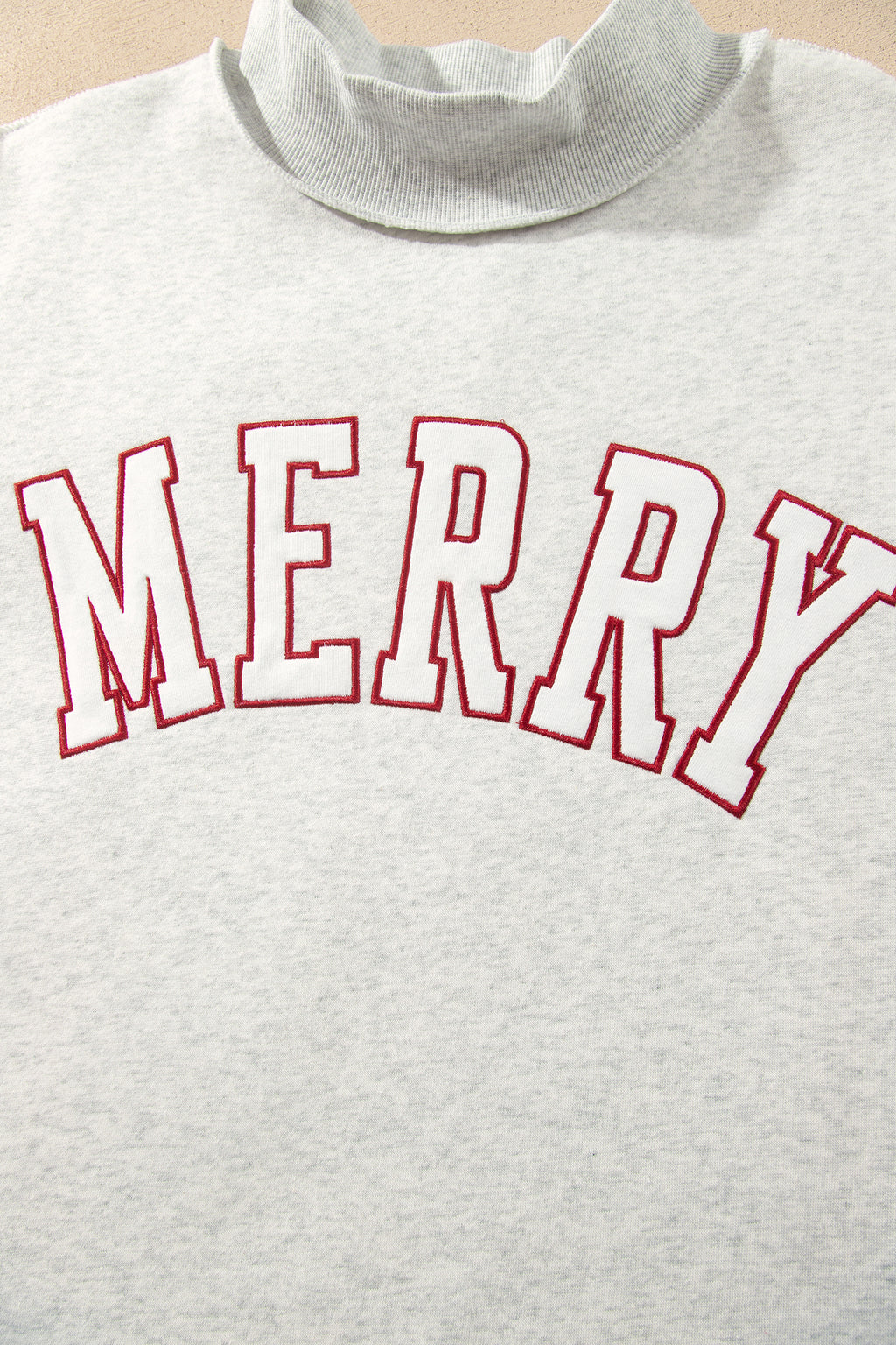 MERRY Embroidered Mockneck