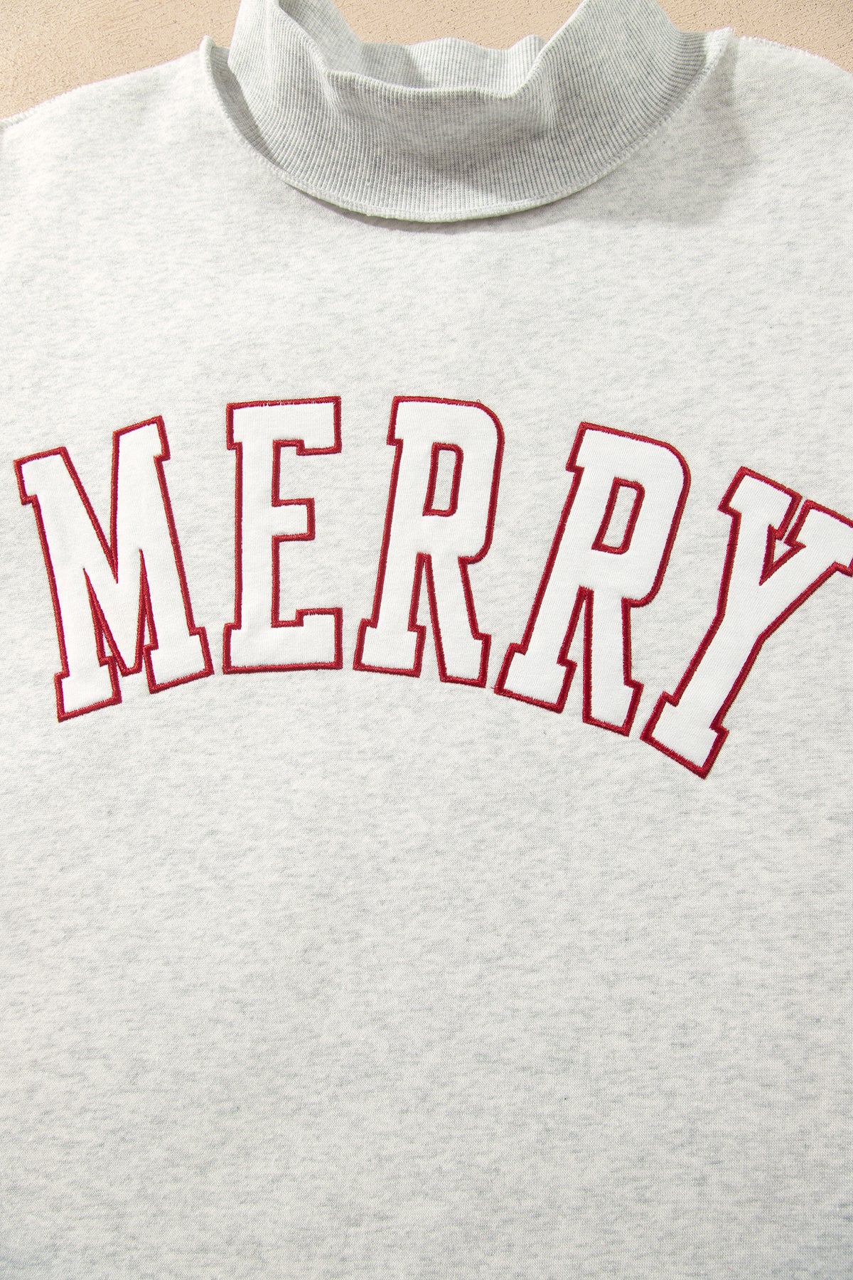 MERRY Embroidered Mockneck