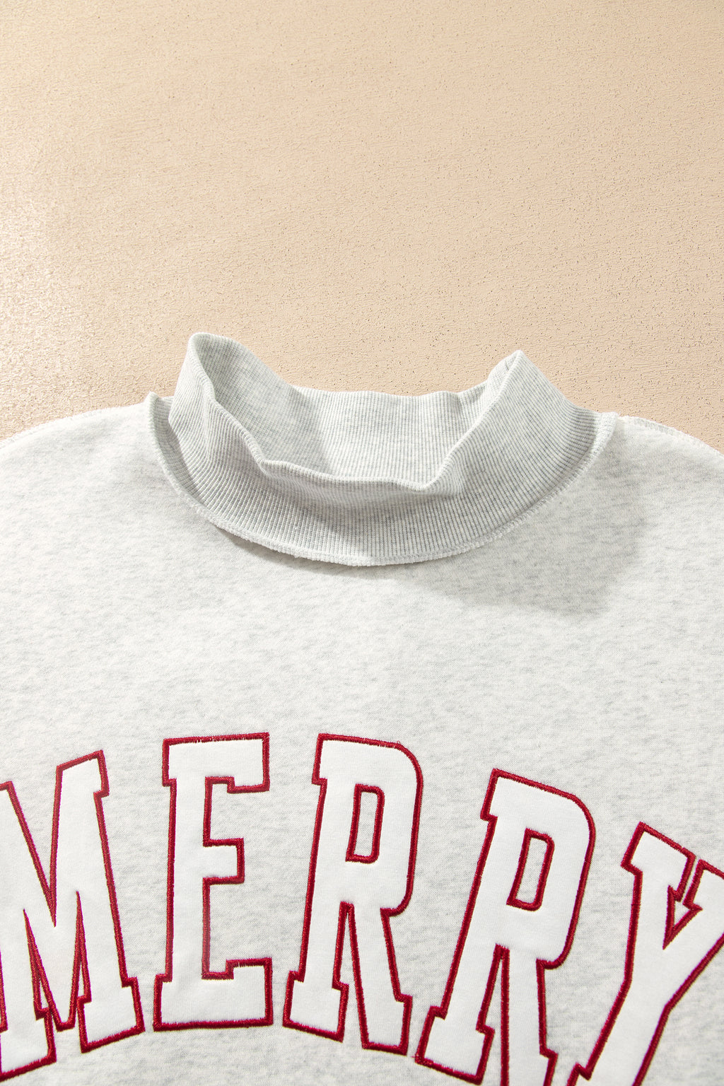 MERRY Embroidered Mockneck