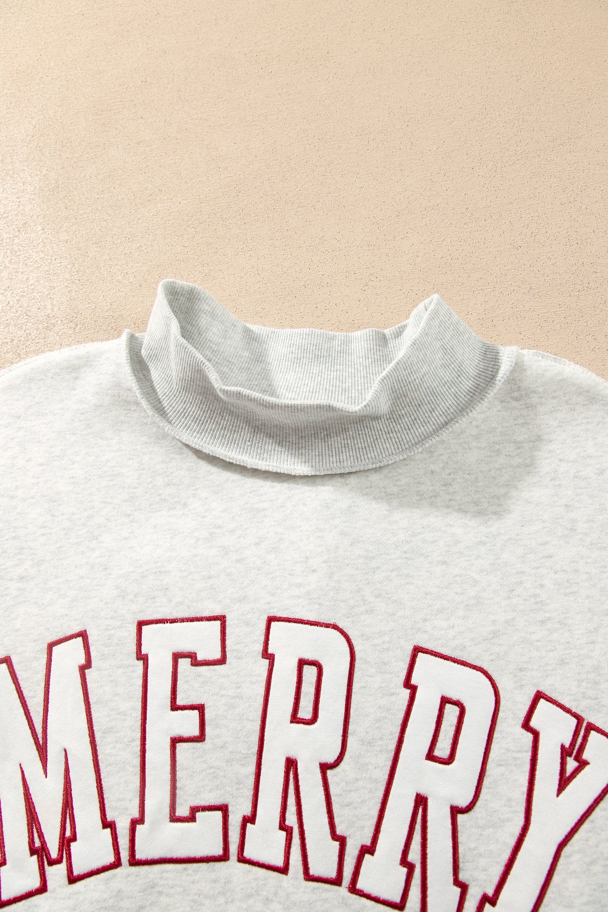 MERRY Embroidered Mockneck